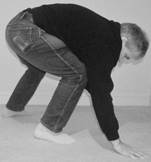 A person bending over

Description automatically generated with low confidence