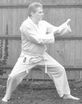 A person in a karate uniform

Description automatically generated with medium confidence